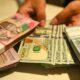 Rupiah Melemah, Dolar AS Dekati Rp18.000